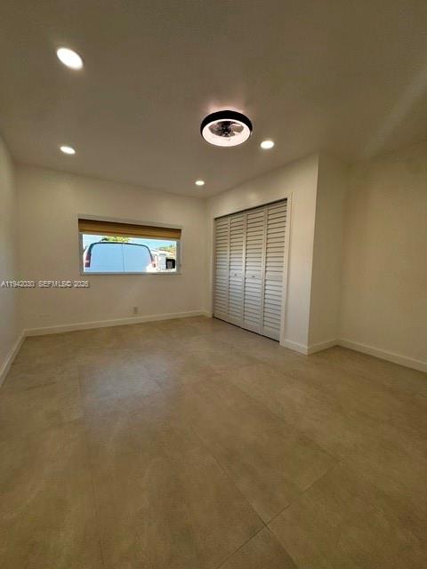 20800 Southwest 114th Court, Unit 20 Miami, FL 33189 - Photo 2 of 13 an empty room with a empty space and windows
