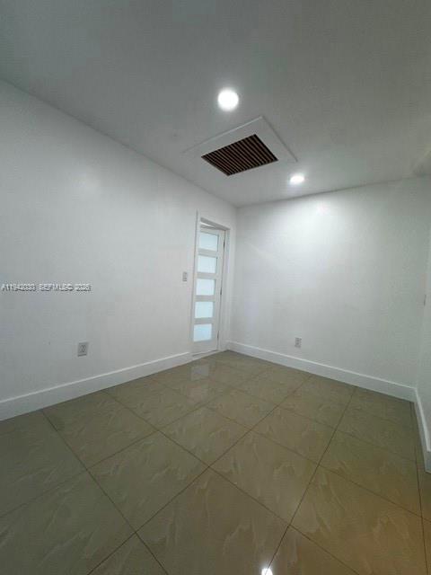 20800 Southwest 114th Court, Unit 20 Miami, FL 33189 - Photo 5 of 13 an empty room with windows