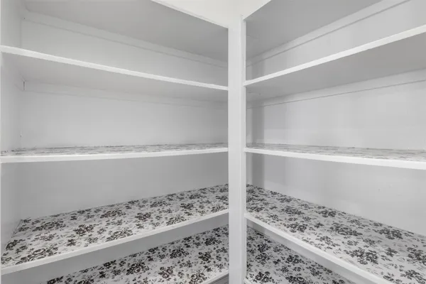 a white toilet sitting next to a shower