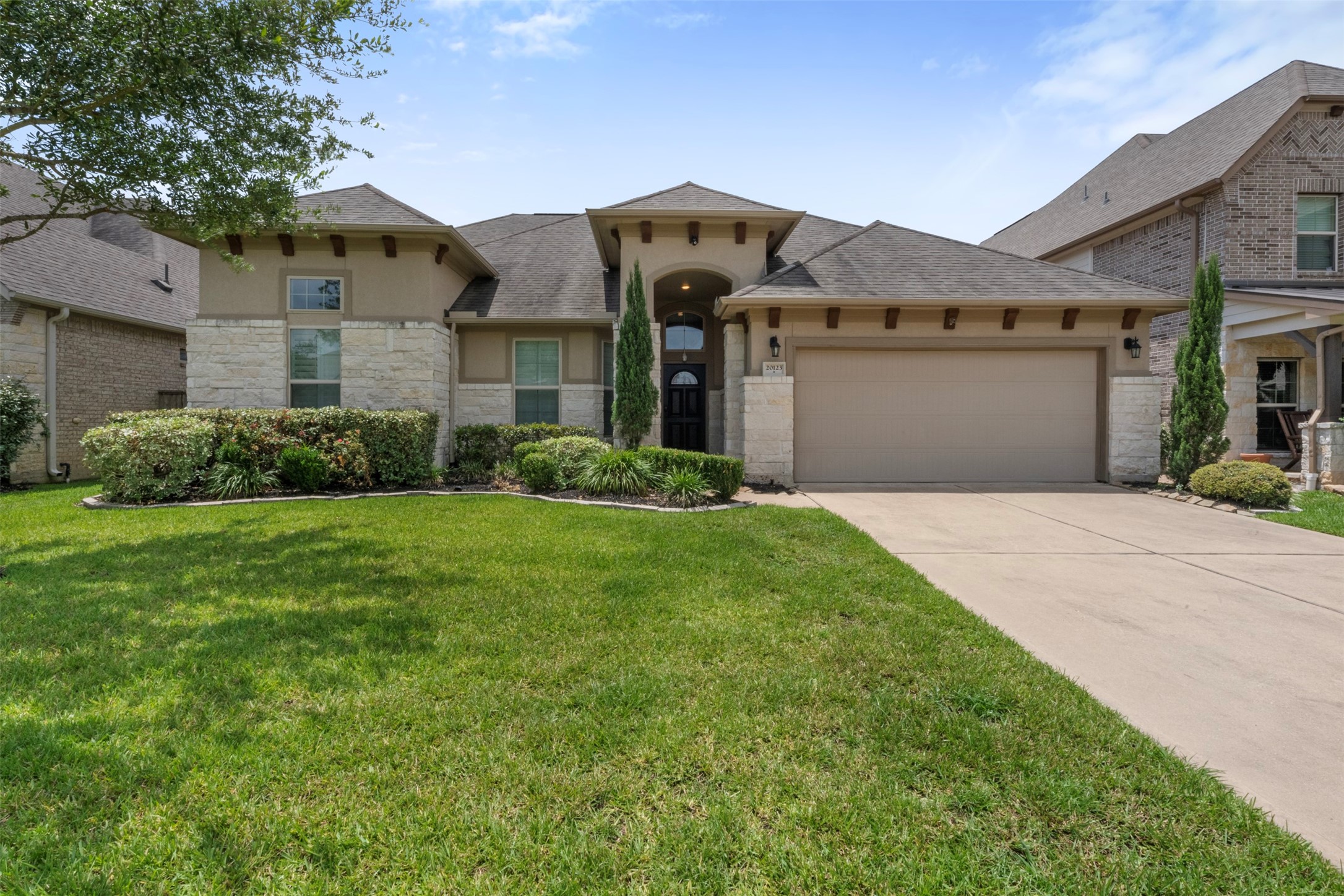 20123 Cascading Falls Boulevard Cypress, TX 77433 - Photo 2 of 41 a front view of a house with garden