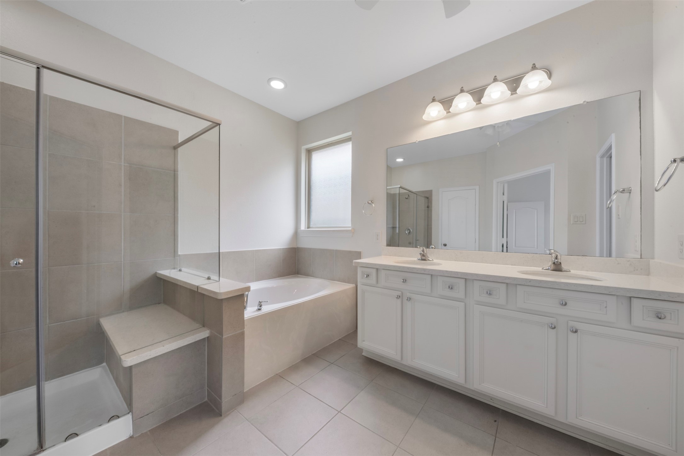 20123 Cascading Falls Boulevard Cypress, TX 77433 - Photo 24 of 41 a spacious bathroom with a double vanity sink mirror and bathtub
