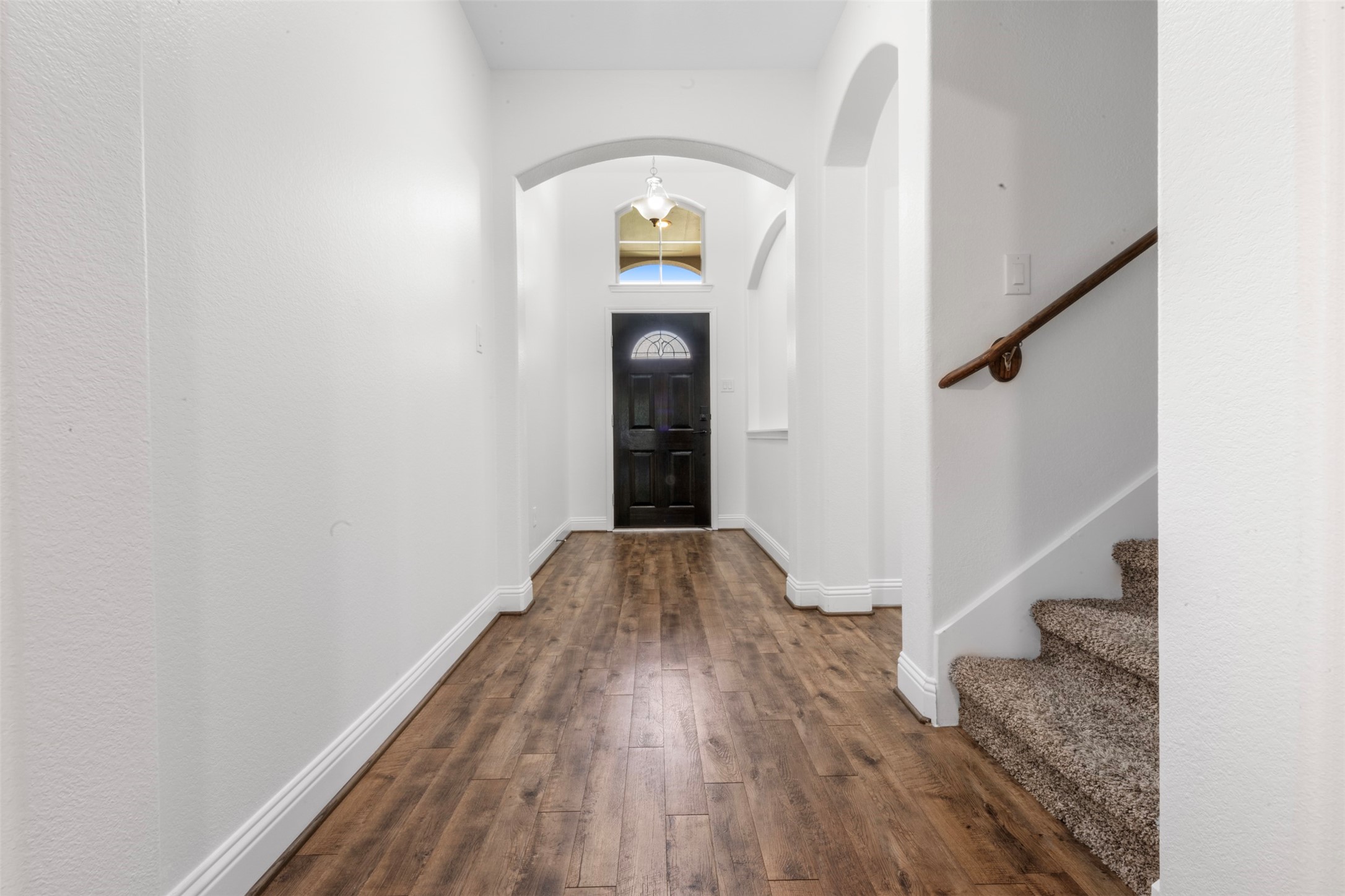20123 Cascading Falls Boulevard Cypress, TX 77433 - Photo 4 of 41 a view of a hallway with wooden floor and staircase