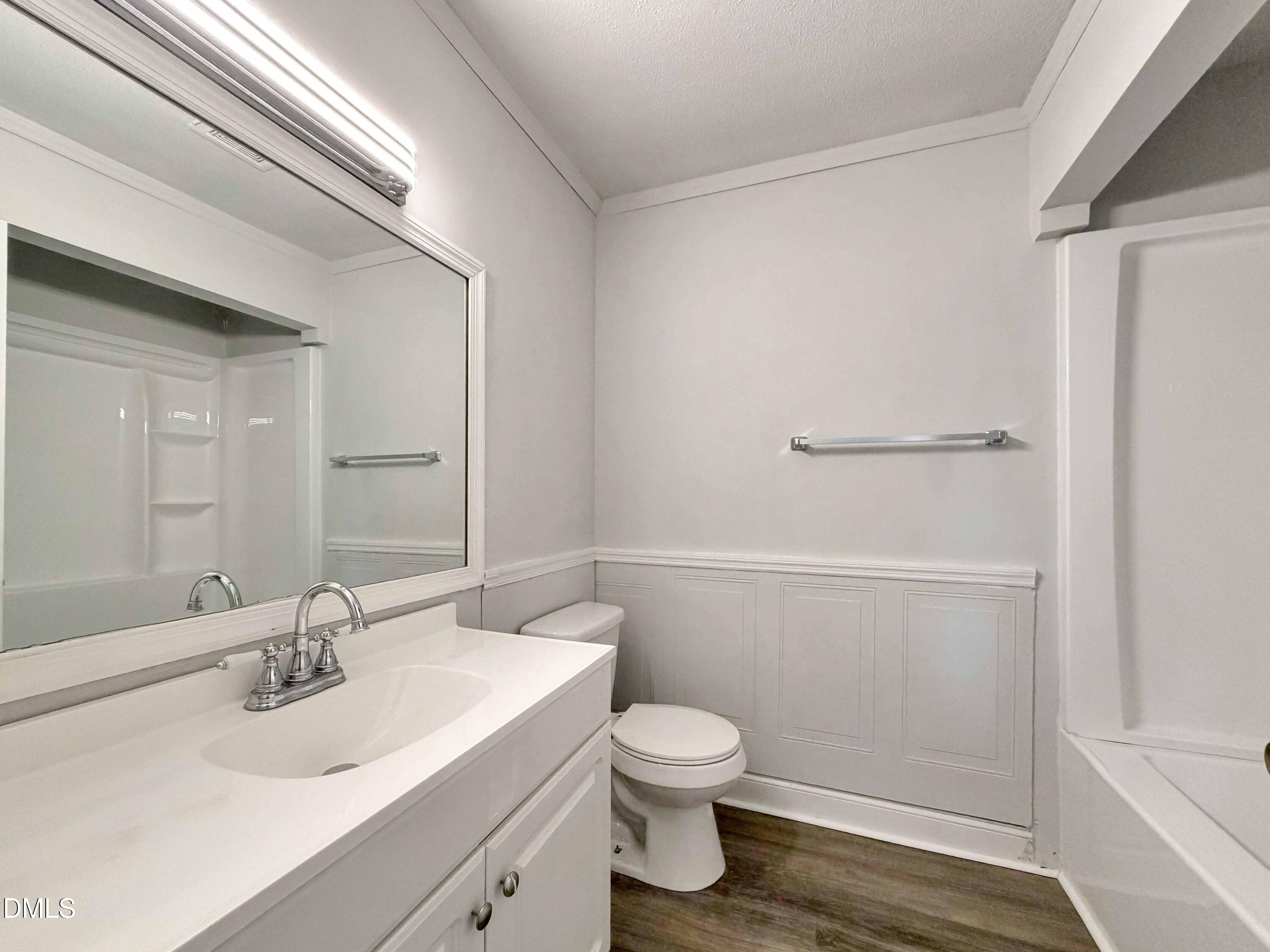 1181 McNeil Street Spring Lake, NC 28390 - Photo 16 of 18 a bathroom with a sink a toilet and shower