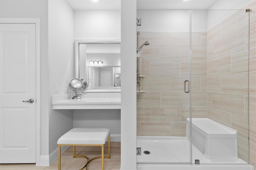 651 Watters Road, Unit 4403 Allen, TX 75013 - Photo 19 of 37 a bathroom with a shower a sink and a mirror