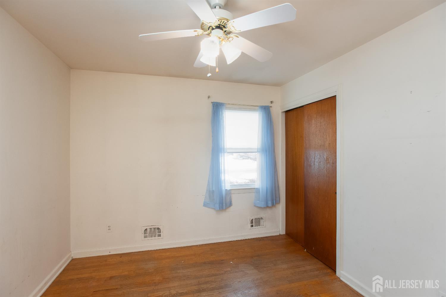 255 Harding Boulevard Matawan, NJ 07747 - Photo 8 of 19 an empty room with fan and entryway