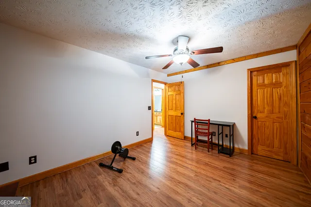 a man sitting on a bench in a room
