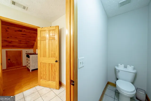 a bathroom with a toilet sink and a shower