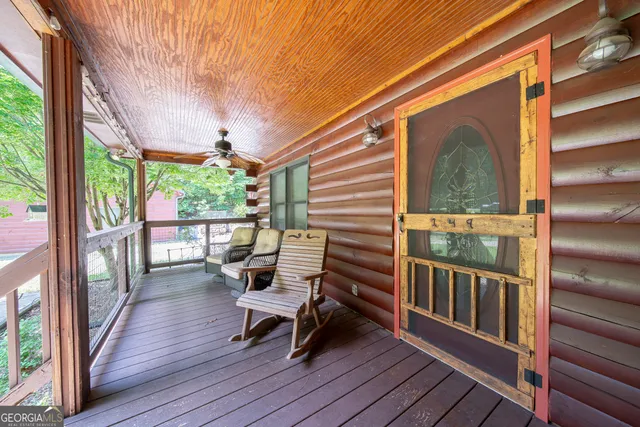 a view of a two chairs in the balcony