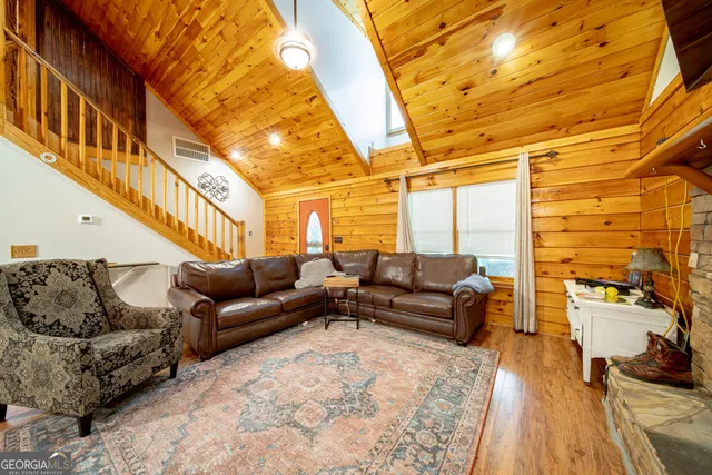 a balcony with furniture and wooden floor