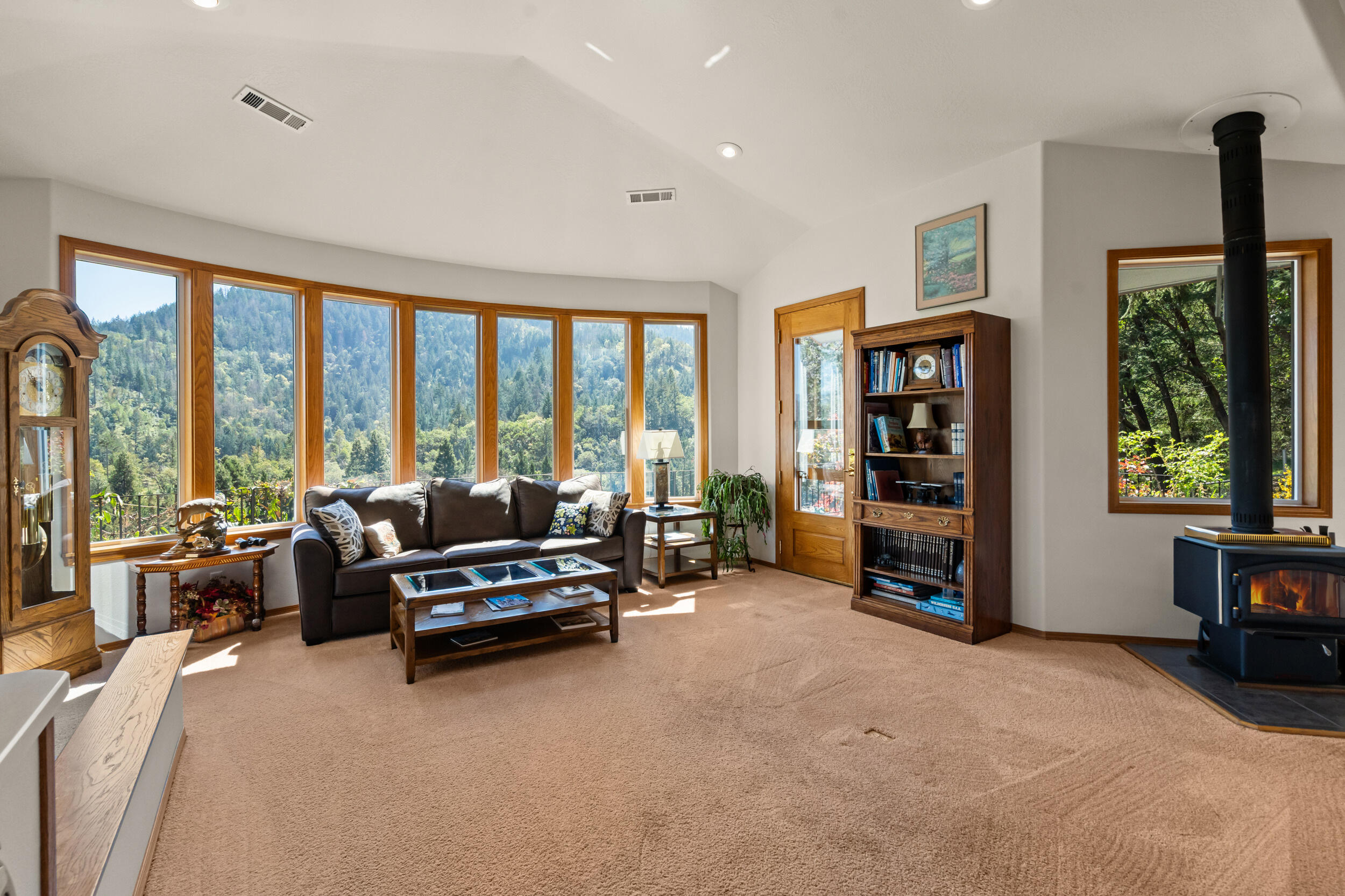 9302 Yank Gulch Road Talent, OR 97540 - Photo 15 of 37 a living room with furniture and large windows