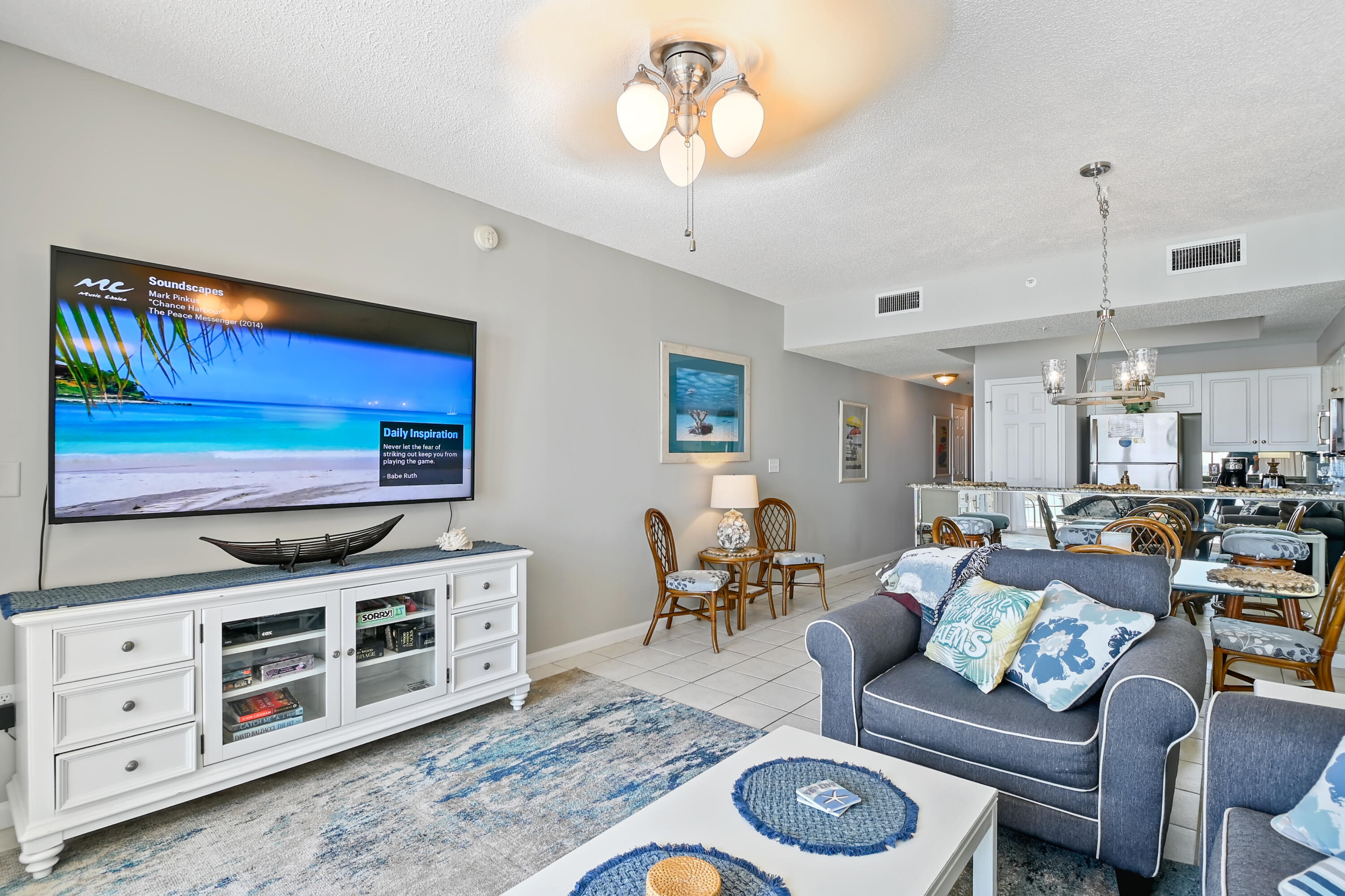 1160 Scenic Gulf Drive, Unit 612A Miramar Beach, FL 32550 - Photo 12 of 31 a living room with furniture a flat screen tv and kitchen view