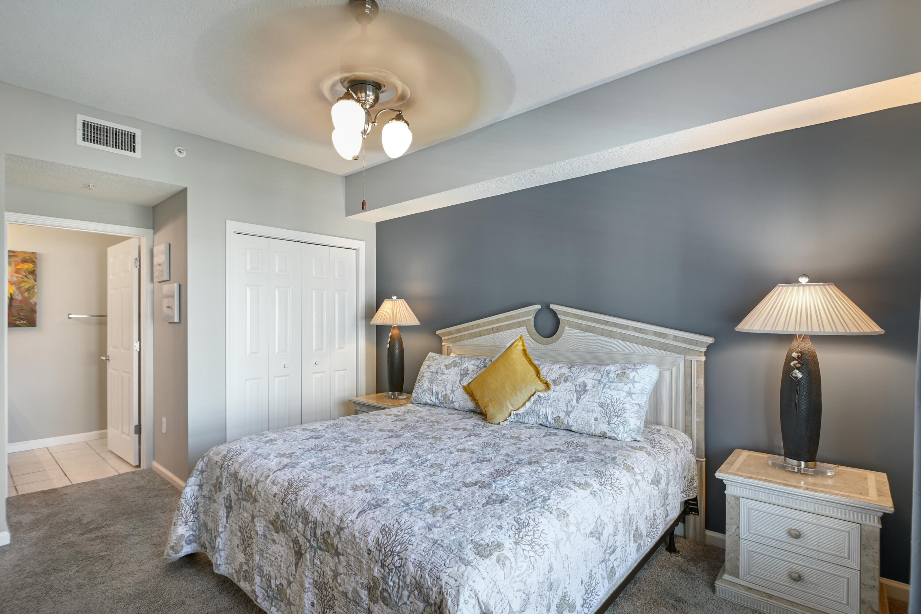 1160 Scenic Gulf Drive, Unit 612A Miramar Beach, FL 32550 - Photo 18 of 31 a bedroom with a bed and a chandelier