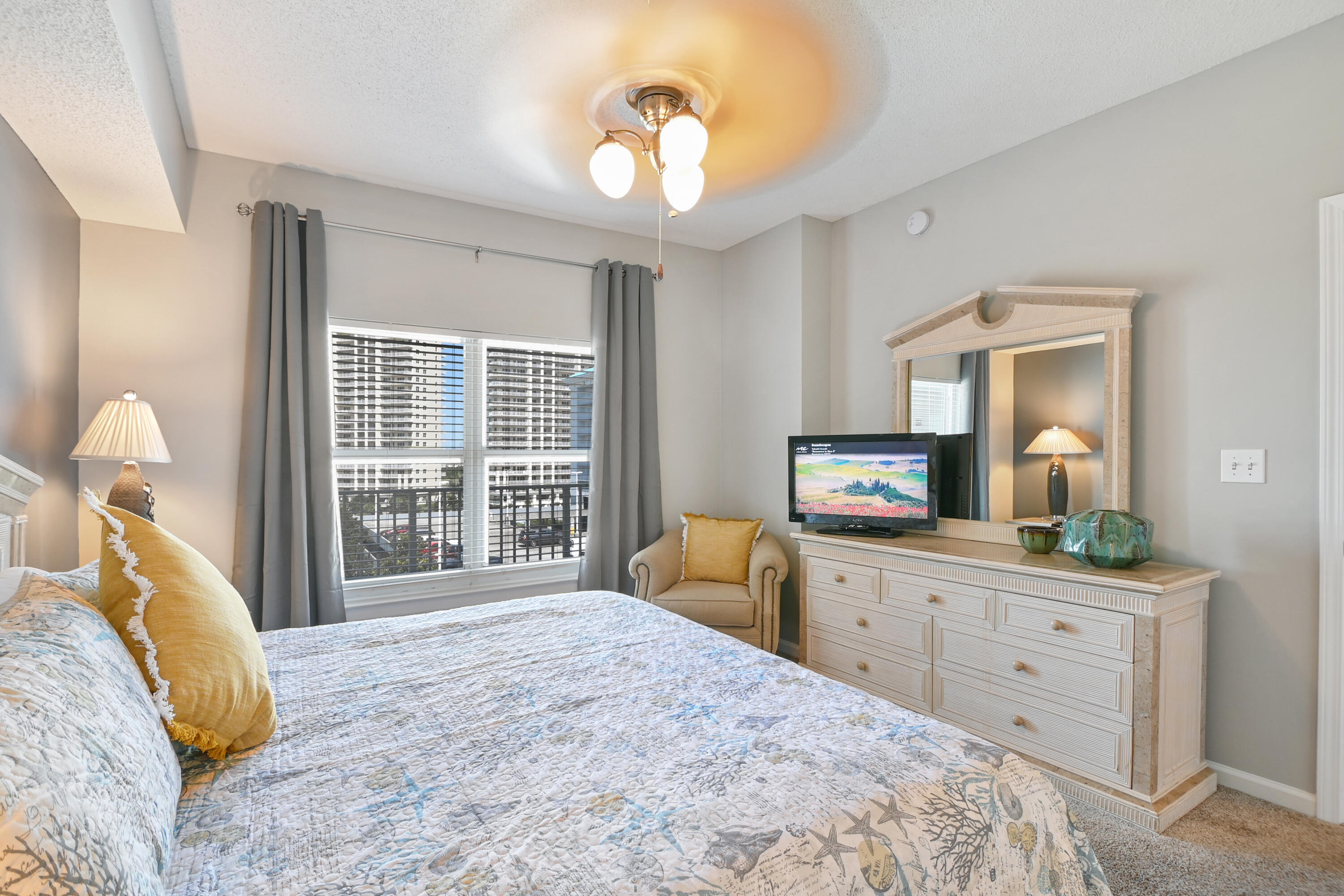 1160 Scenic Gulf Drive, Unit 612A Miramar Beach, FL 32550 - Photo 20 of 31 a bedroom with a bed and a chandelier