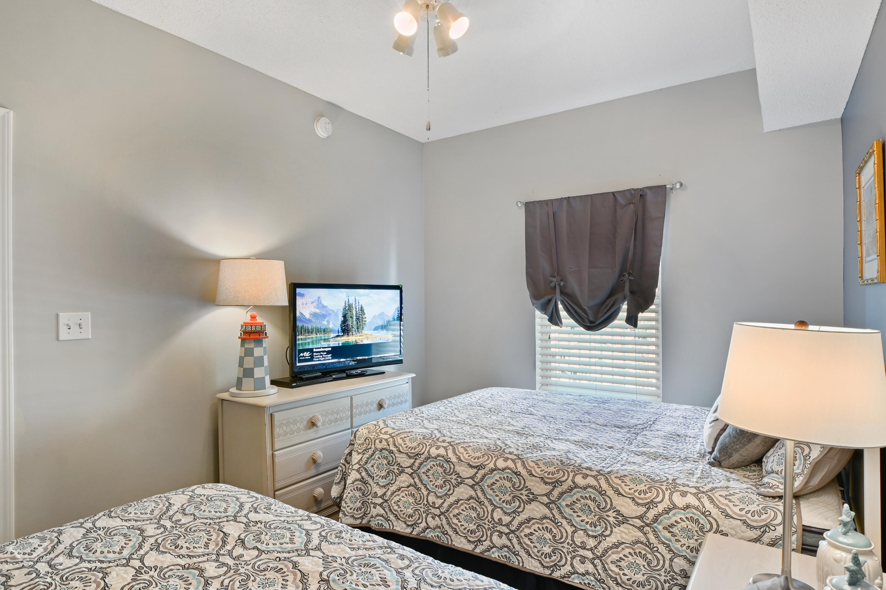 1160 Scenic Gulf Drive, Unit 612A Miramar Beach, FL 32550 - Photo 24 of 31 a bedroom with a bed and a dresser in it