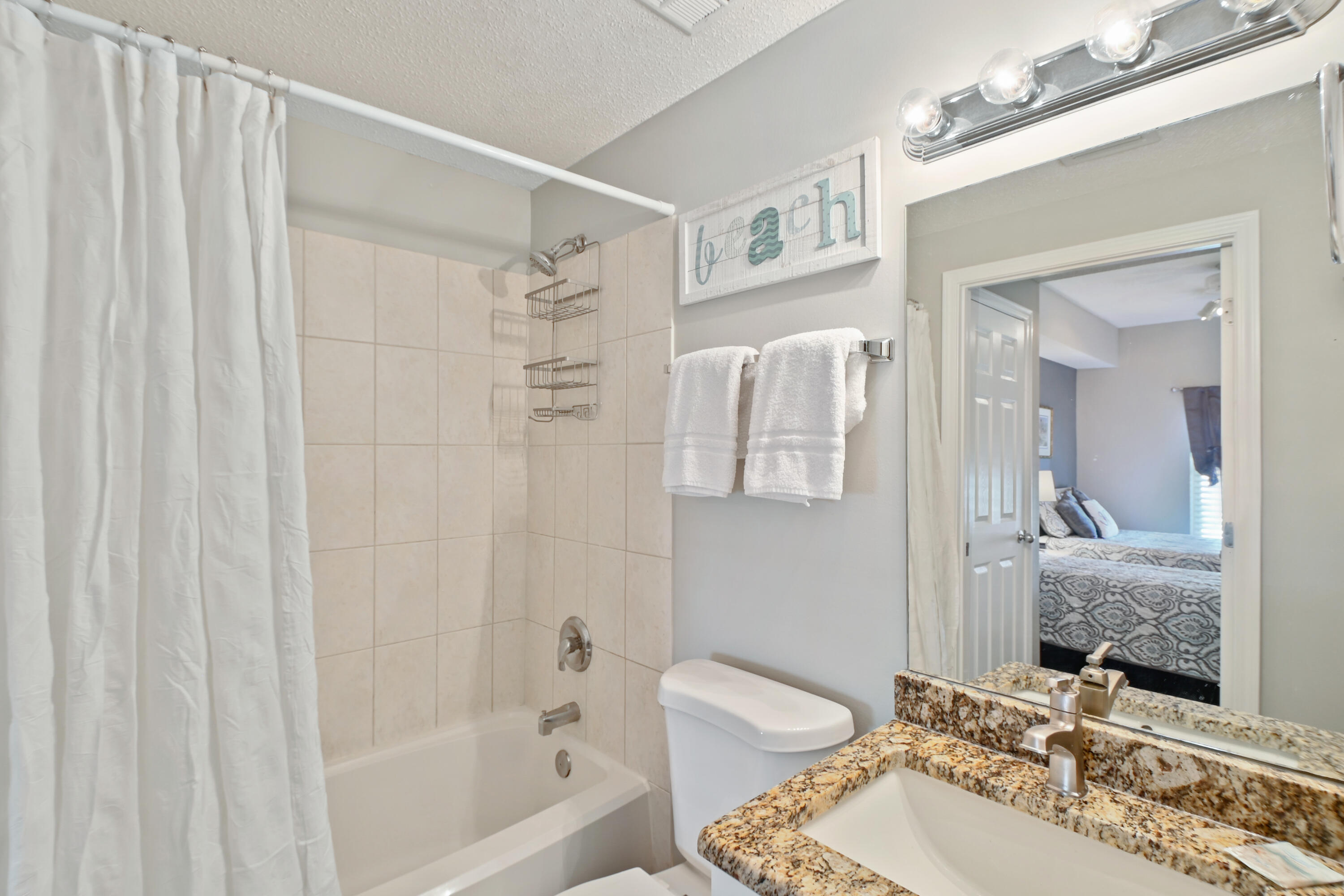 1160 Scenic Gulf Drive, Unit 612A Miramar Beach, FL 32550 - Photo 26 of 31 a bathroom with a sink and a mirror