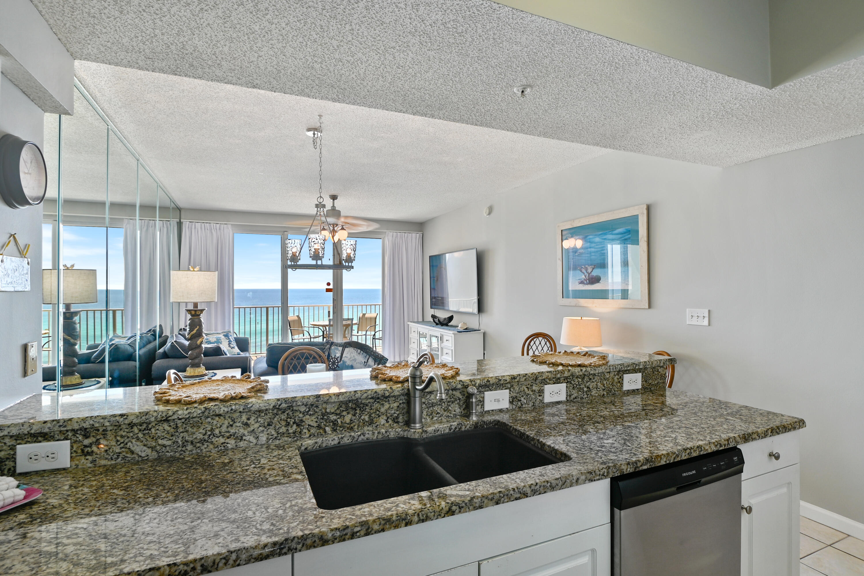 1160 Scenic Gulf Drive, Unit 612A Miramar Beach, FL 32550 - Photo 5 of 31 a kitchen with granite countertop a sink and a granite counter tops