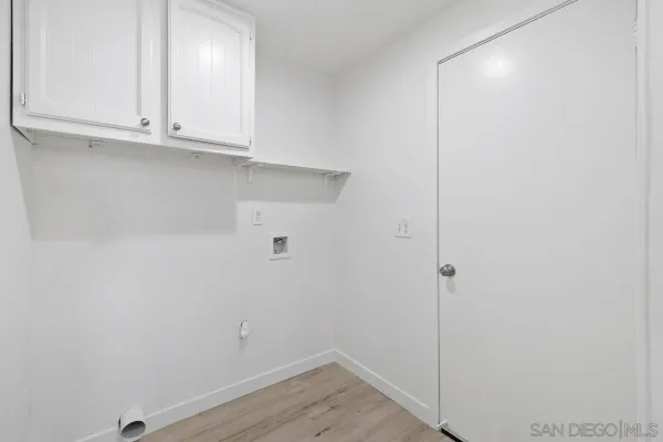 a view of cabinets and utility room