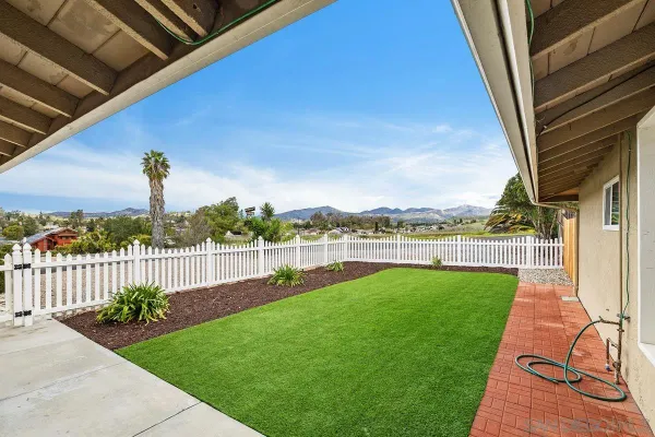 a view of a backyard with a garden