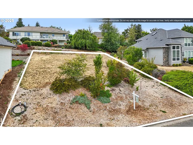 a view of a terrace with a garden and bench