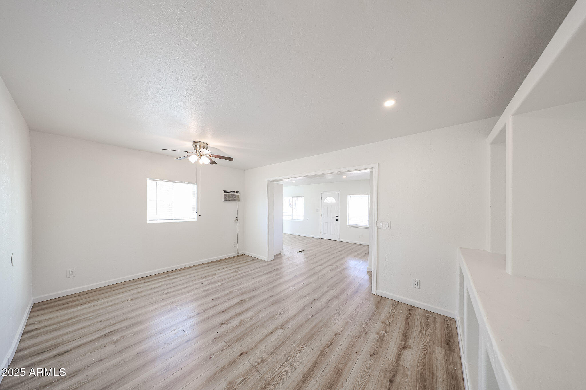 2839 East Marco Polo Road Phoenix, AZ 85050 - Photo 12 of 43 wooden floor in an empty room with a window