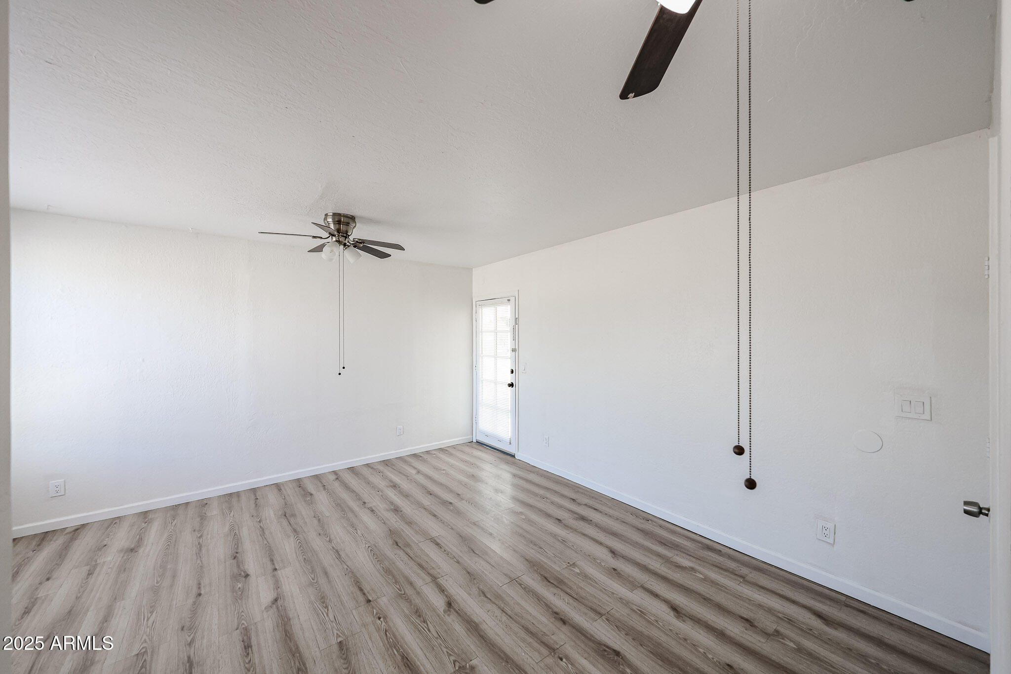 2839 East Marco Polo Road Phoenix, AZ 85050 - Photo 19 of 43 a view of a room with wooden floor