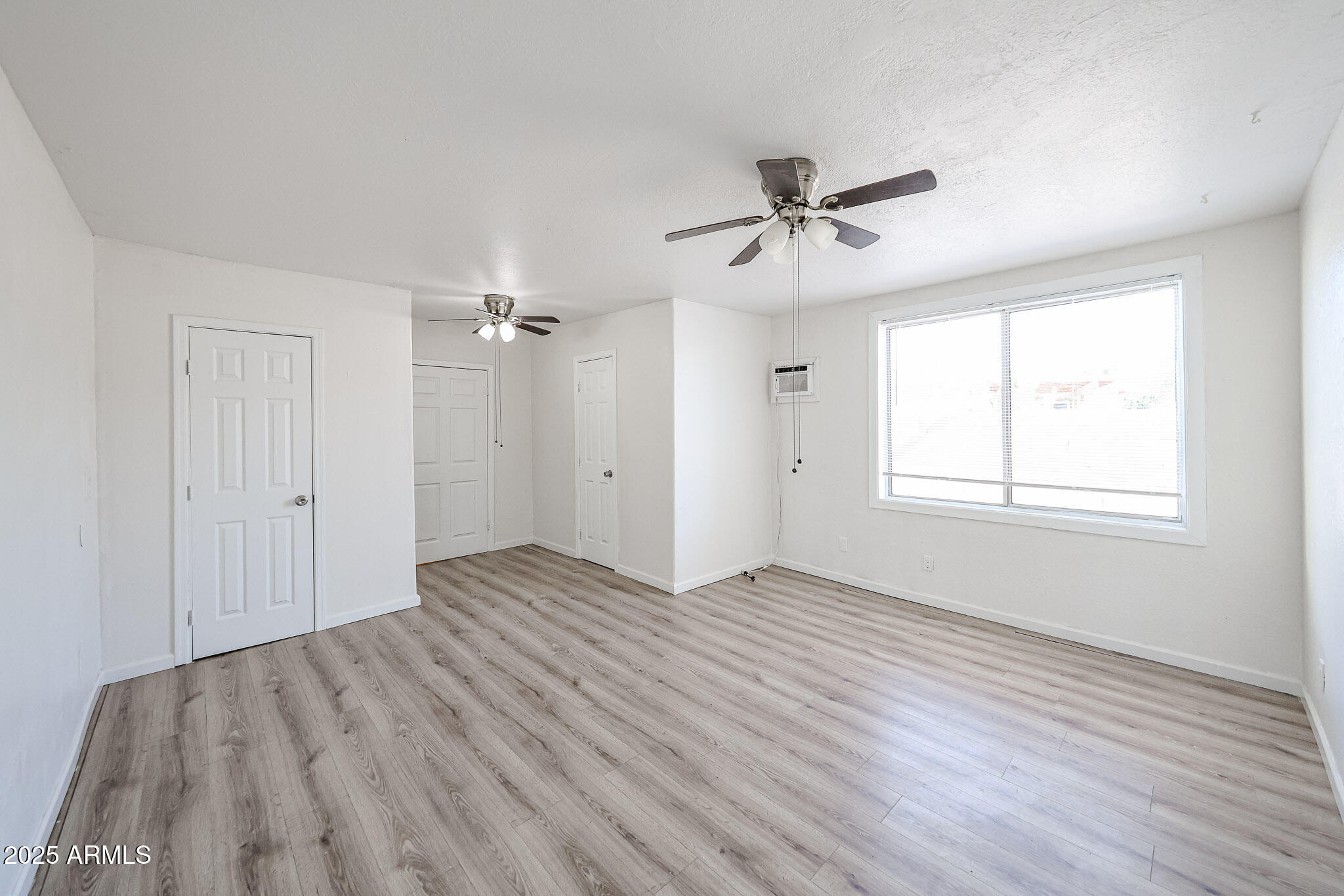 2839 East Marco Polo Road Phoenix, AZ 85050 - Photo 20 of 43 wooden floor in an empty room with a window