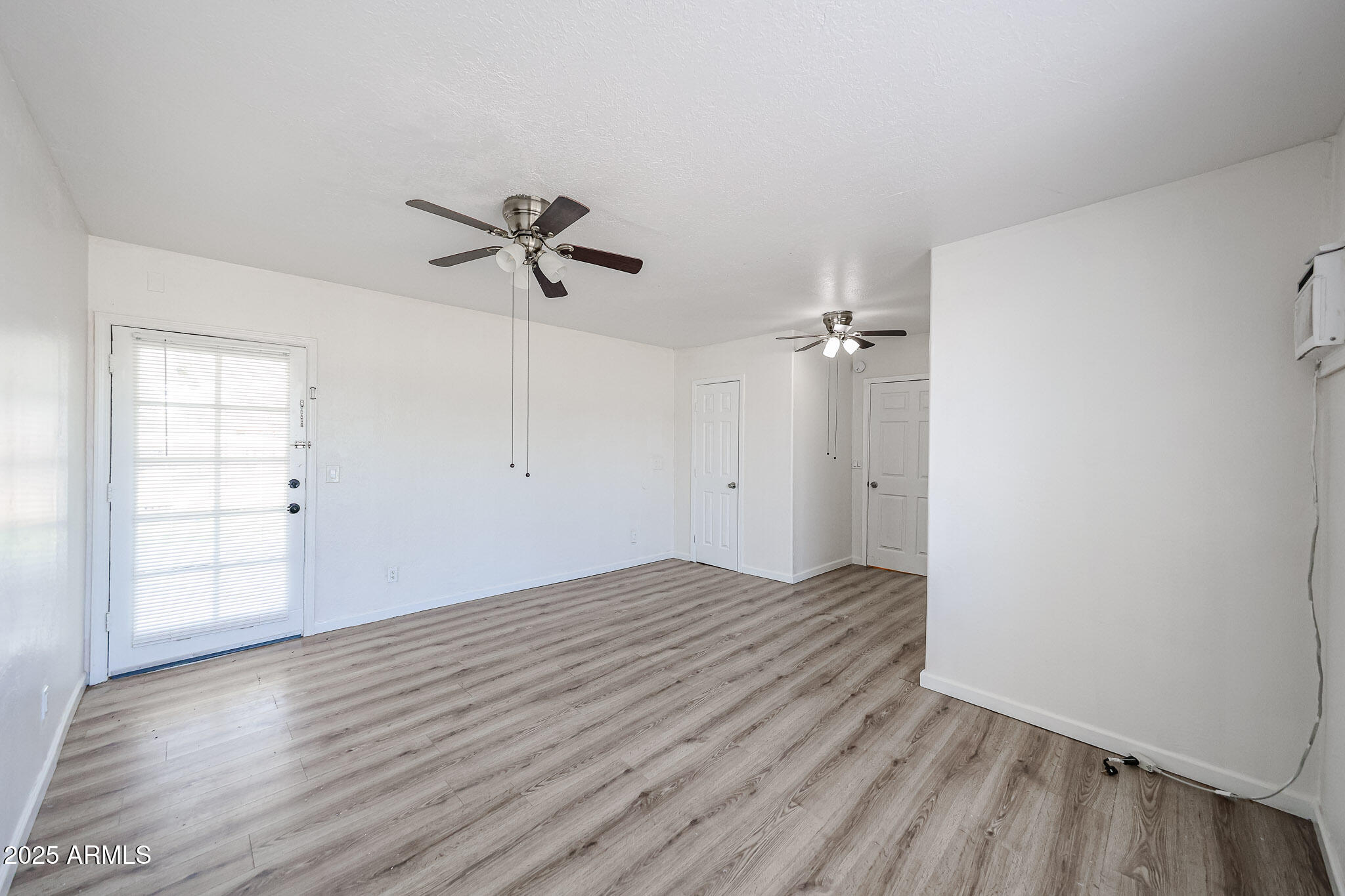 2839 East Marco Polo Road Phoenix, AZ 85050 - Photo 21 of 43 wooden floor in an empty room with a window