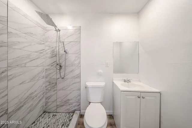 a view of a kitchen with wooden floor and a kitchen