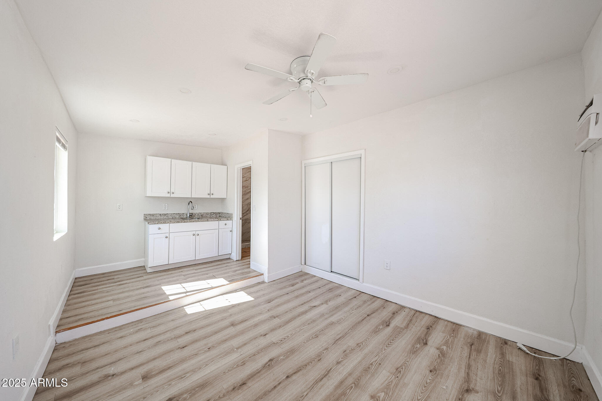 2839 East Marco Polo Road Phoenix, AZ 85050 - Photo 25 of 43 a view of a kitchen with wooden floor and a kitchen
