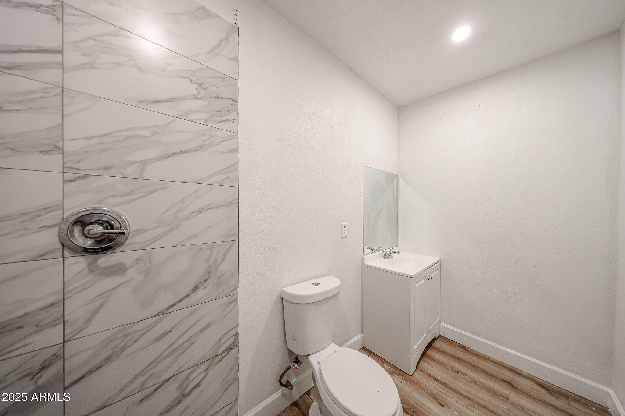 2839 East Marco Polo Road Phoenix, AZ 85050 - Photo 29 of 43 a white toilet sitting next to a shower