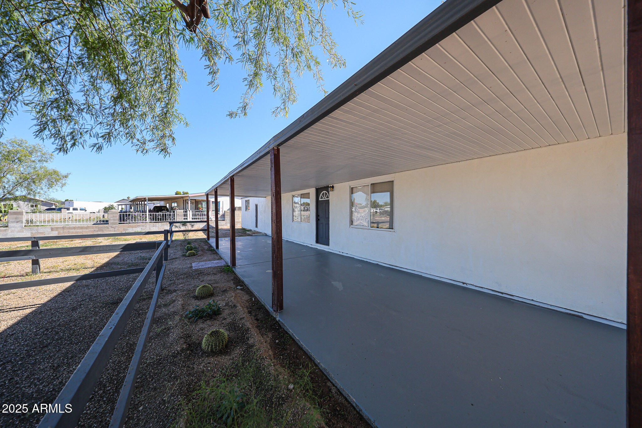2839 East Marco Polo Road Phoenix, AZ 85050 - Photo 32 of 43 a view of a balcony with wooden floor and fence