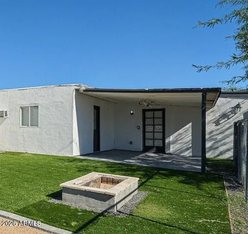 a view of a garden with an outdoor space