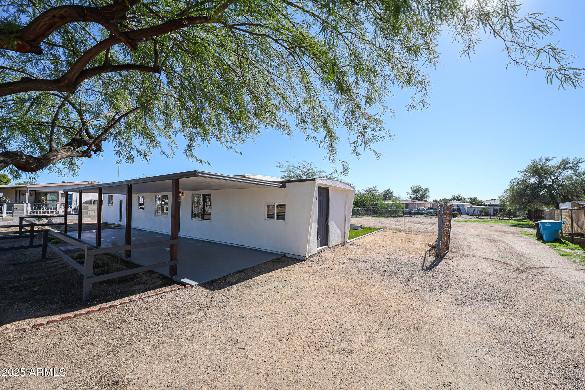 2839 East Marco Polo Road Phoenix, AZ 85050 - Photo 4 of 43 a backyard of a house with table and chairs
