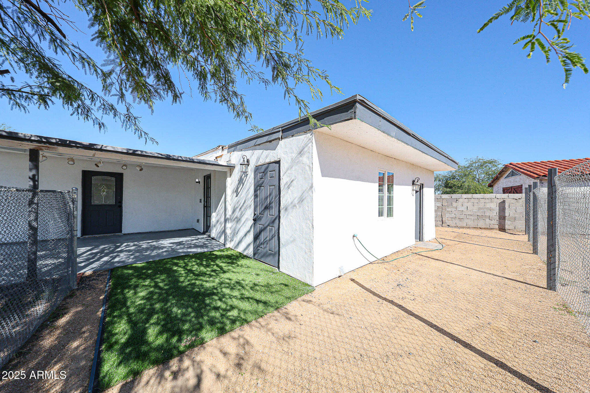 2839 East Marco Polo Road Phoenix, AZ 85050 - Photo 43 of 43 a backyard of a house with lots of green space