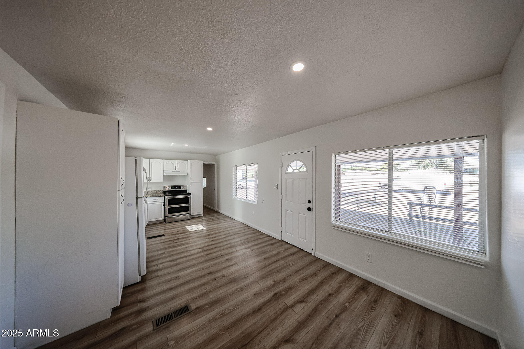 2839 East Marco Polo Road Phoenix, AZ 85050 - Photo 8 of 43 wooden floor in an empty room with a window
