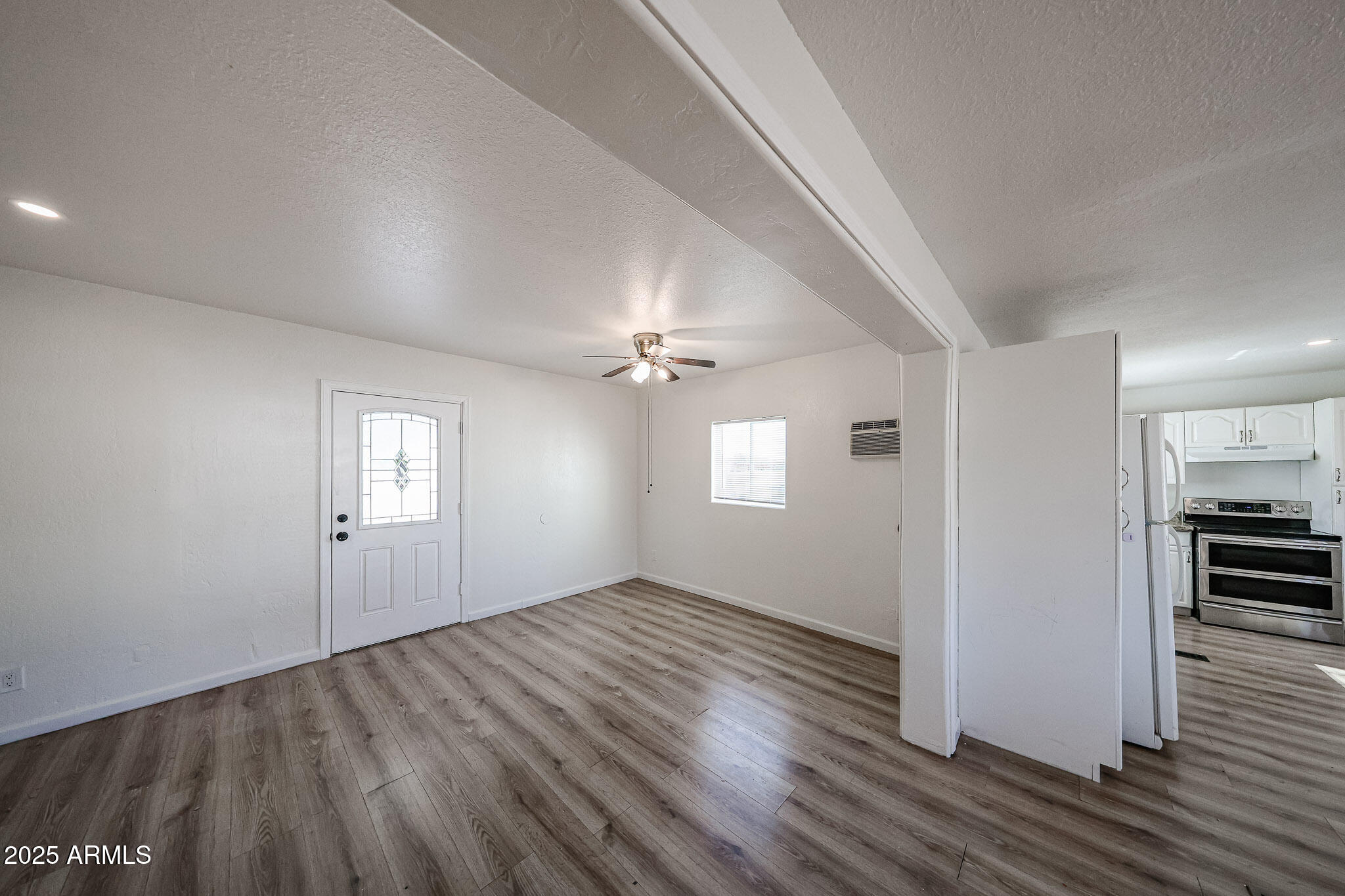 2839 East Marco Polo Road Phoenix, AZ 85050 - Photo 9 of 43 wooden floor in an empty room with a window