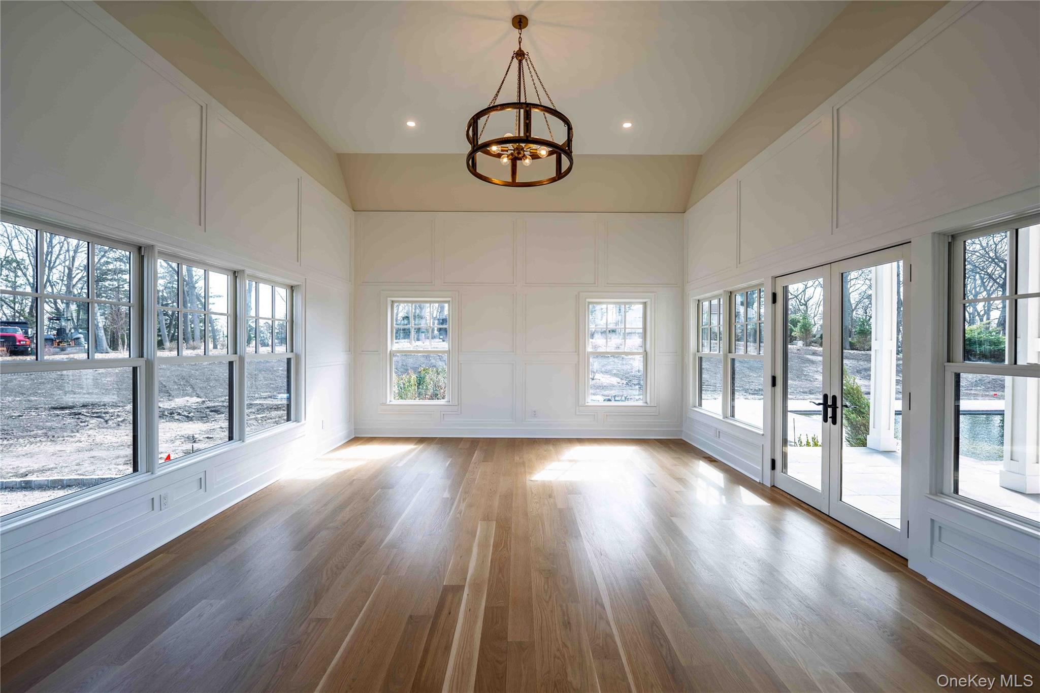 106 Cove Road Northport, NY 11768 - Photo 15 of 49 a view of an room with wooden floor and windows