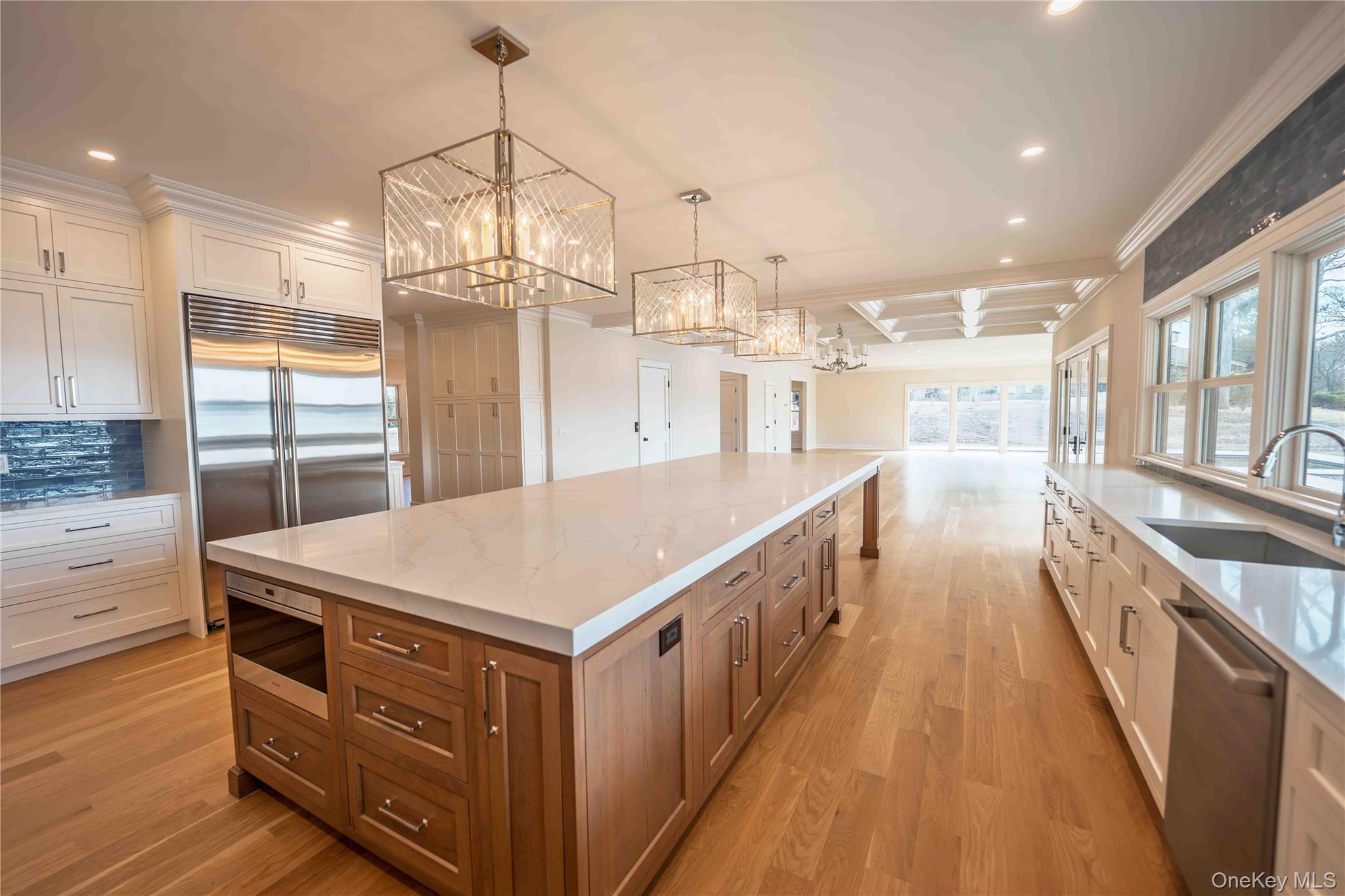 106 Cove Road Northport, NY 11768 - Photo 10 of 49 a kitchen that has a lot of cabinets in it