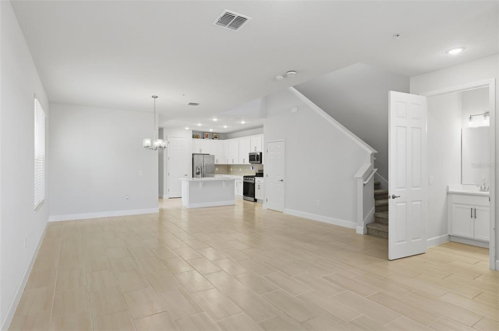 269 Platform Lane DeBary, FL 32713 - Photo 11 of 41 a view of an empty room with kitchen and window