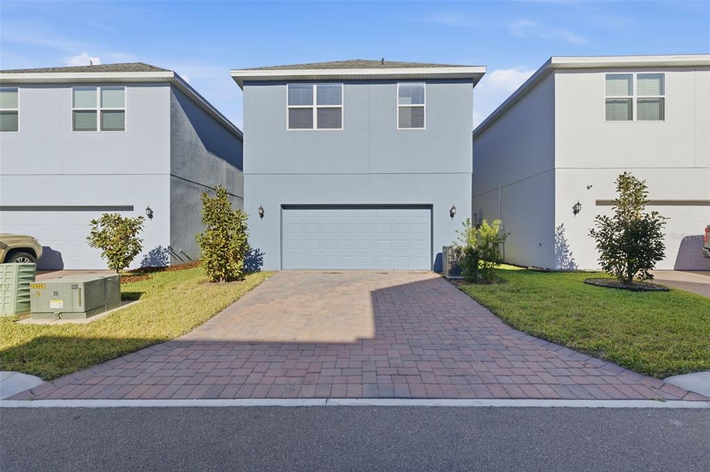 269 Platform Lane DeBary, FL 32713 - Photo 39 of 41 a front view of a house with a yard and garage