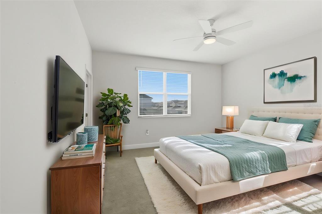 269 Platform Lane DeBary, FL 32713 - Photo 8 of 41 a bedroom with a bed and a flat screen tv