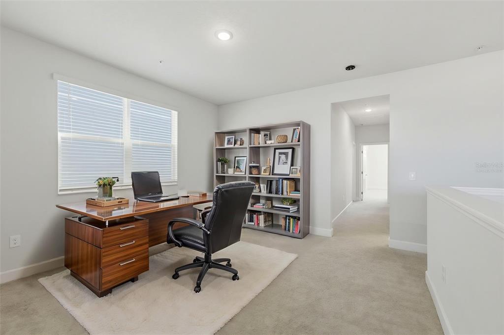 269 Platform Lane DeBary, FL 32713 - Photo 10 of 41 a view of a workspace with furniture and a window