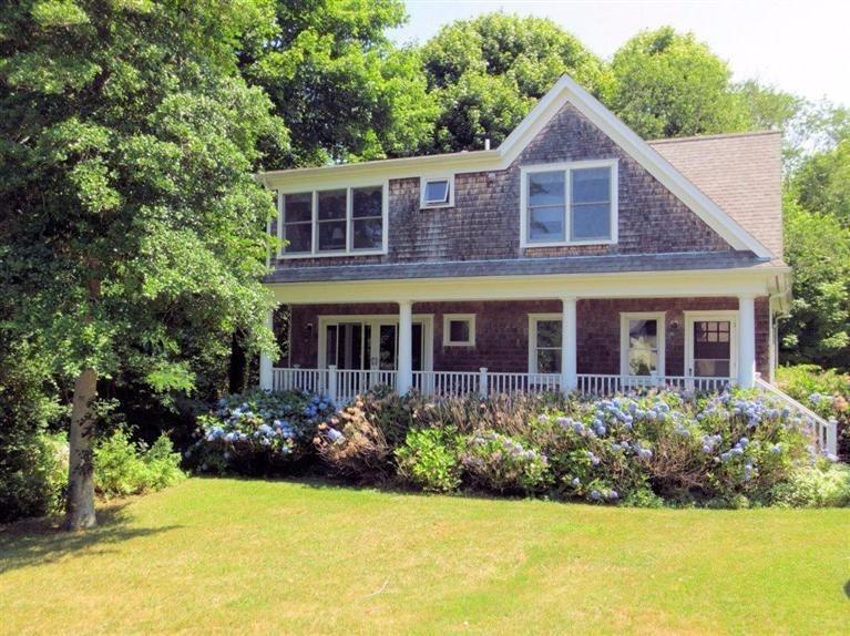 41 Chapoquoit Road Falmouth, MA 02540 - Photo 18 of 19 a view of a house with garden and yard