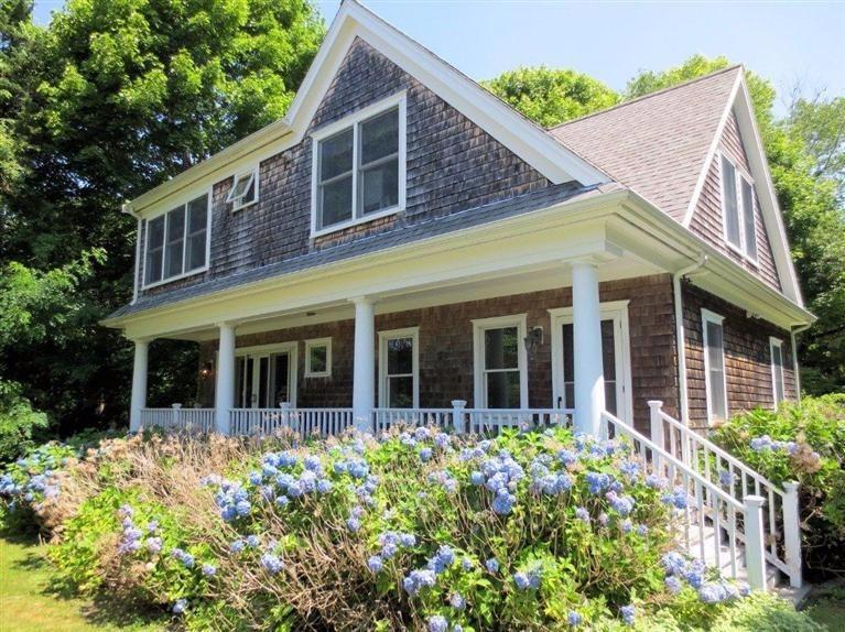 41 Chapoquoit Road Falmouth, MA 02540 - Photo 19 of 19 front view of a brick house with a large window