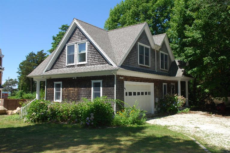 41 Chapoquoit Road Falmouth, MA 02540 - Photo 5 of 19 a view of a house with yard and plants