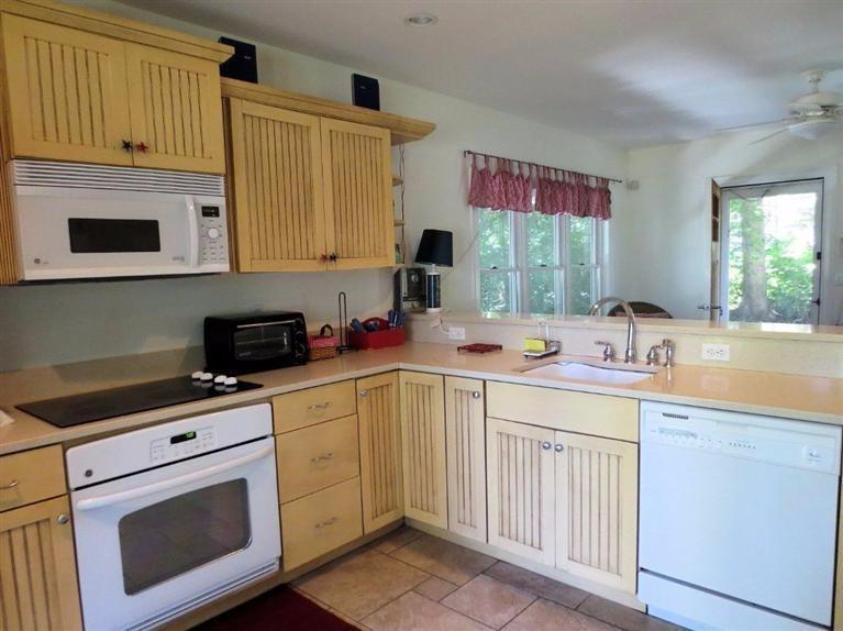 41 Chapoquoit Road Falmouth, MA 02540 - Photo 8 of 19 a kitchen with a sink cabinets and window