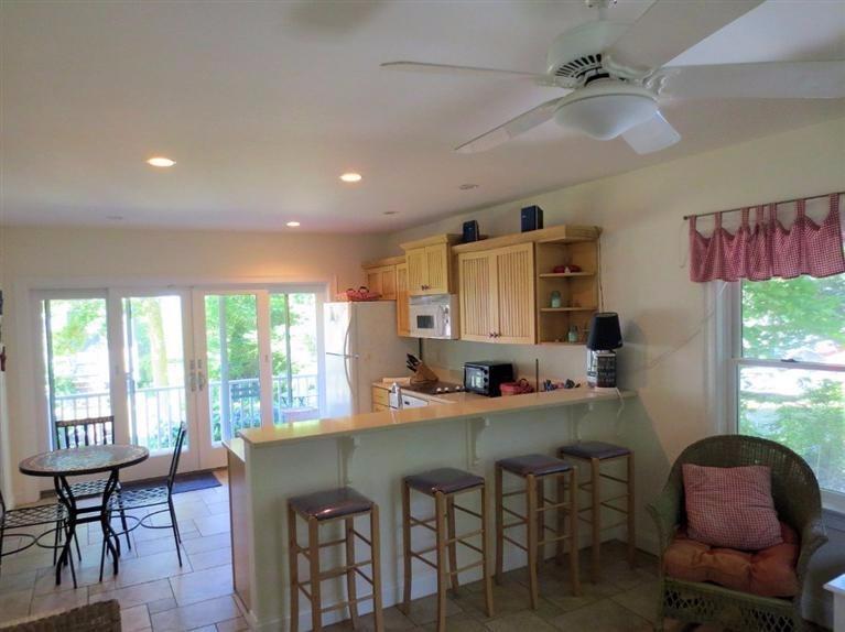 41 Chapoquoit Road Falmouth, MA 02540 - Photo 9 of 19 a view of a dining room with furniture window and outside view