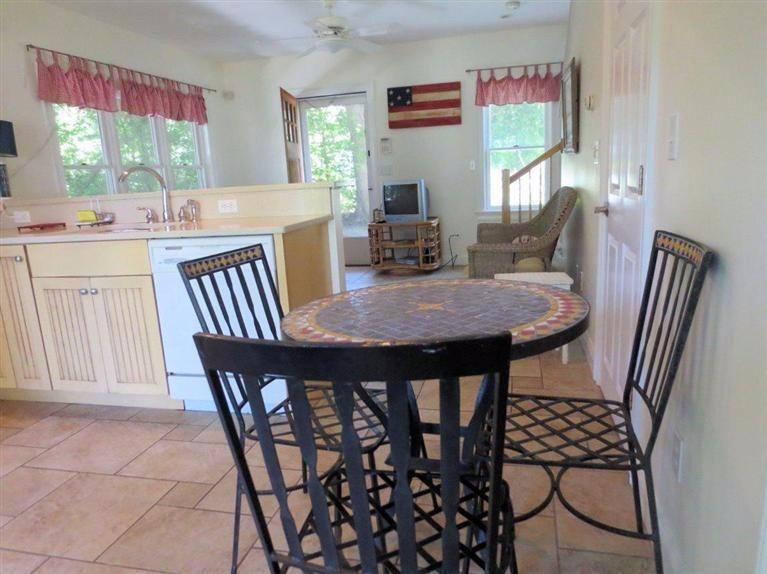 41 Chapoquoit Road Falmouth, MA 02540 - Photo 10 of 19 a view of a dining room with furniture and window