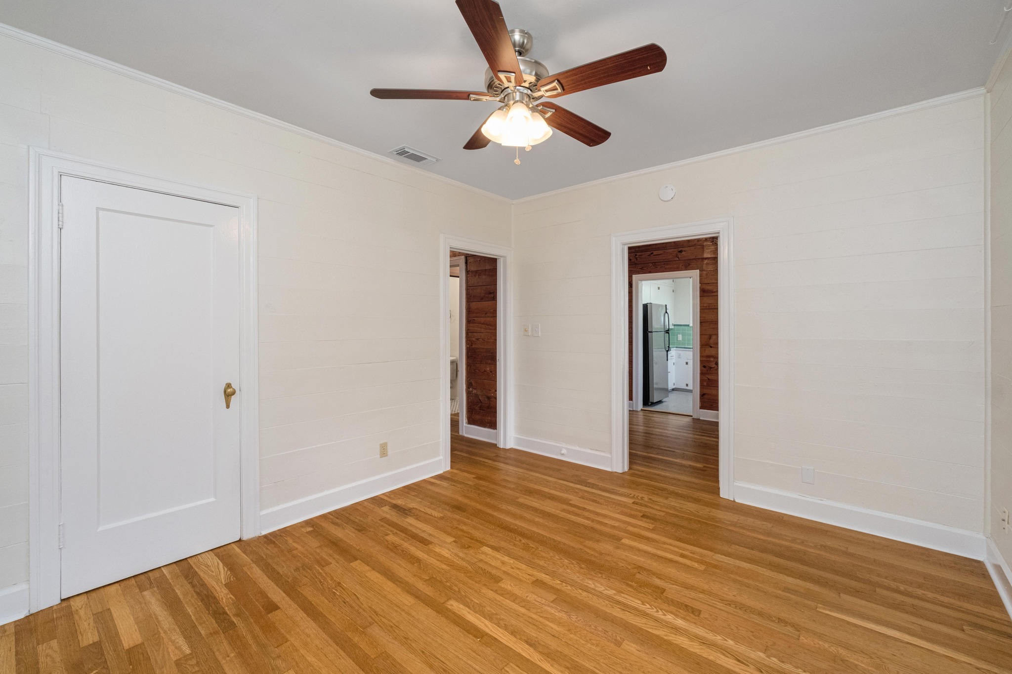 2012 Enfield Road, Unit B Austin, TX 78703 - Photo 15 of 20 Warm hardwood floors and a classic ceiling fan create a comfortable atmosphere.