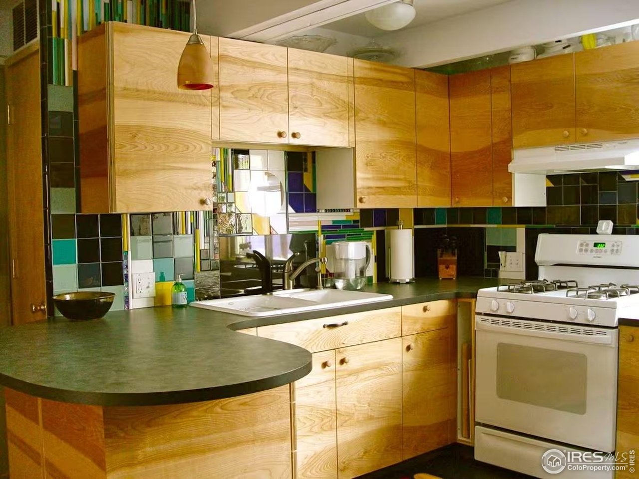 636 Marine Street Boulder, CO 80302 - Photo 21 of 46 a view of a kitchen with a sink and cabinets